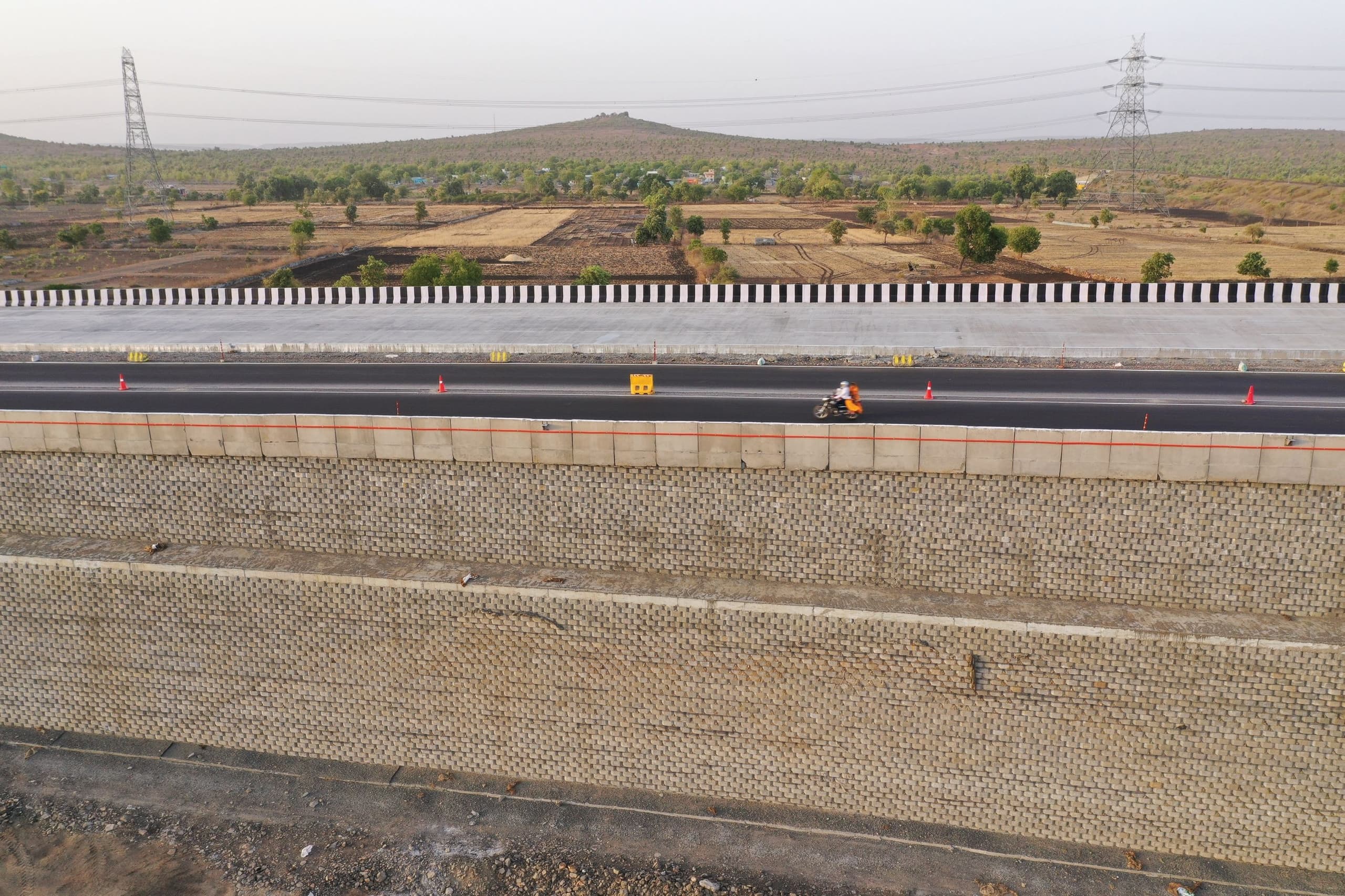 Applying a two-tiered reinforced soil system for a rail overbridge