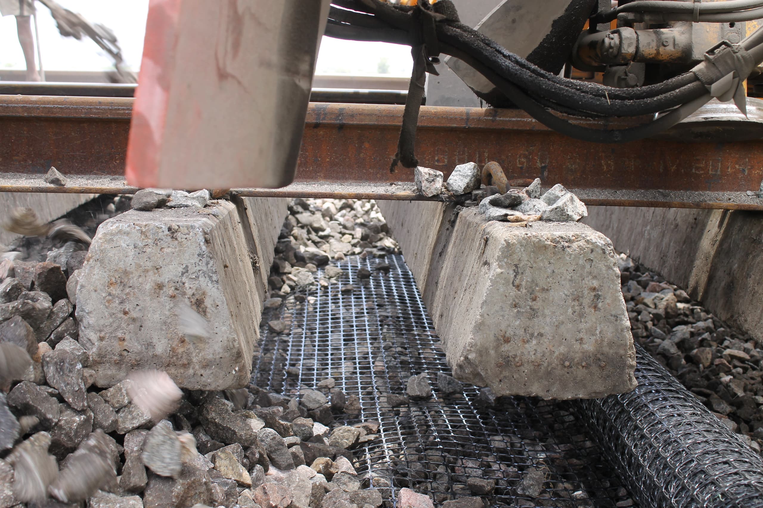 Ballast and sub-ballast reinforcement