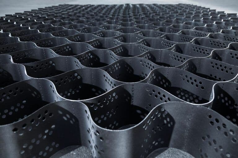 What are the disadvantages of not using a geocell in road construction?