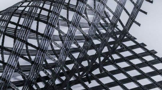 High-strength uniaxial and biaxial geogrids